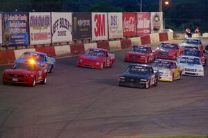 The field stays behind the pace car on a pace lap.