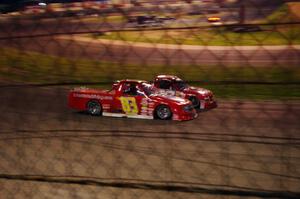 Andy Jirik’s Chevy and Jerry Wood’s Chevy side-by-side through turns 3 and 4