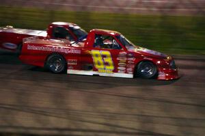 Andy Jirik’s Chevy and Jerry Wood’s Chevy side-by-side through turns 3 and 4