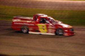 Andy Jirik’s Chevy and Jerry Wood’s Chevy side-by-side through turns 3 and 4