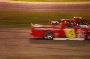 Andy Jirik’s Chevy and Jerry Wood’s Chevy side-by-side through turns 3 and 4