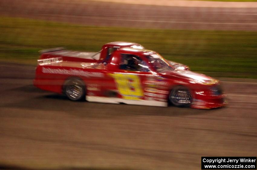 Andy Jirik’s Chevy and Jerry Wood’s Chevy side-by-side through turns 3 and 4