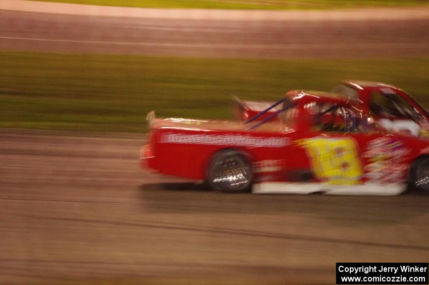 Andy Jirik’s Chevy and Jerry Wood’s Chevy side-by-side through turns 3 and 4