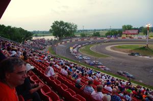 Fans watching cars come onto the front straight out of 4