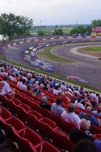 Fans watching cars come onto the front straight out of 4