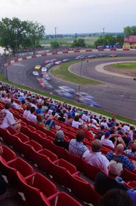 Fans watching cars come onto the front straight out of 4