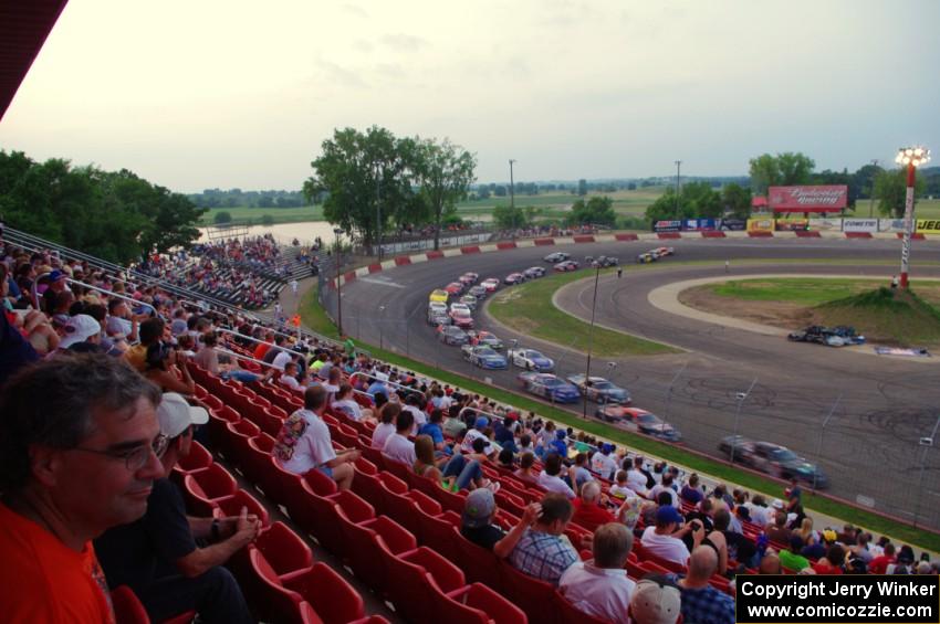 Fans watching cars come onto the front straight out of 4