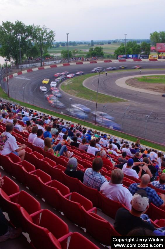 Fans watching cars come onto the front straight out of 4