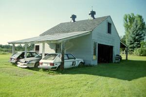 A Dodge Omni, a Dodge Daytona and ITB Dodge Omni next to the barn.