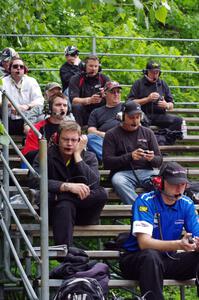 Spotters on the outside grandstands at Canada Corner