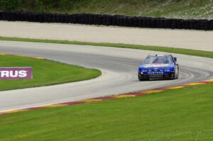 Doug Harrington's Ford Mustang exits the carousel