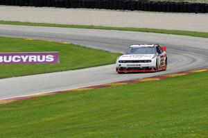 Jacques Villeneuve's Dodge Challenger exits the carousel