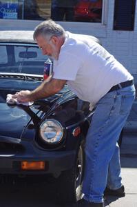 Dwight McCullough polishes his MGB