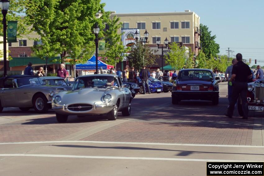 Main street of Osseo, MN with a Jaguar XKE readying to get into position