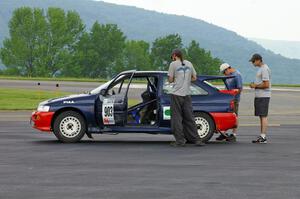 The Chris Sanborn / Chris Stark Ford Escort Cosworth awaits tech.