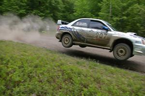 Patrick Brennan / Shane McCann catch big air at the finish of the practice stage in their Subaru WRX STi.