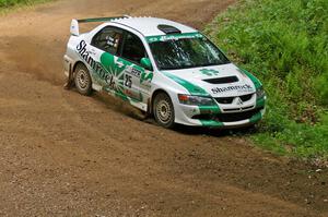 The Seamus Burke / Eddie Fries Mitsubishi Lancer Evo 9 does a bit of ditch-hooking at a hairpin on SS9.