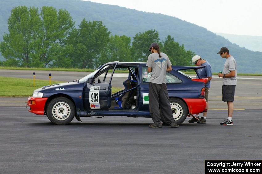 The Chris Sanborn / Chris Stark Ford Escort Cosworth awaits tech.