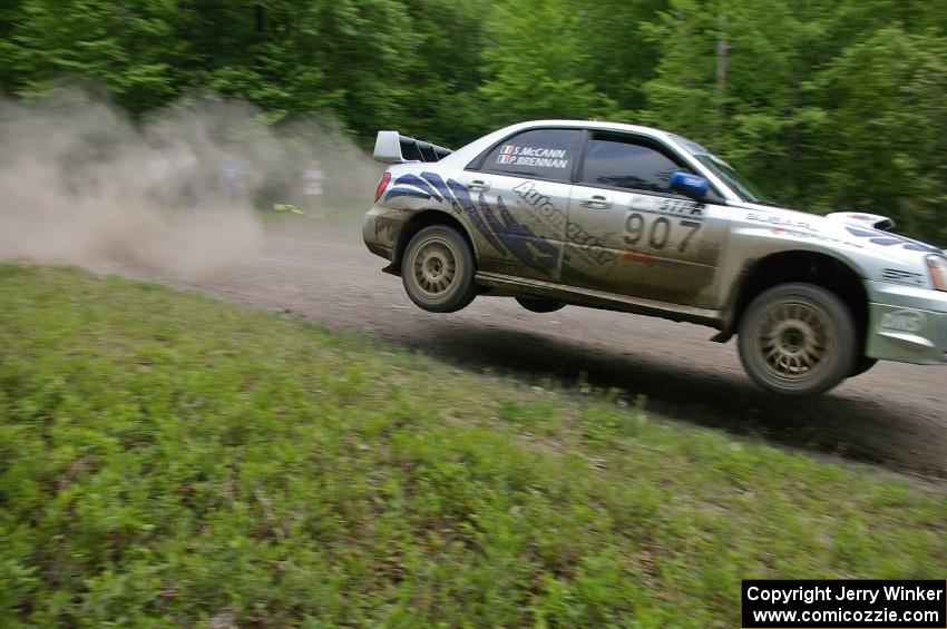 Patrick Brennan / Shane McCann catch big air at the finish of the practice stage in their Subaru WRX STi.