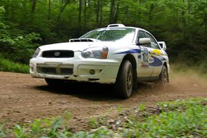 George Georgakopoulos / Faruq Mays Subaru WRX at a hairpin on SS3.