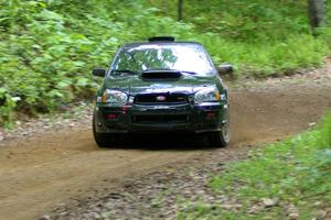 Josh Chang / Donald DeRose Subaru WRX STi gets a bit sideways out of a hairpin on SS3.