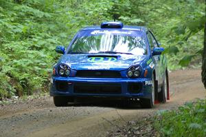 Heath Nunnemacher / Heidi Nunnemacher rocket uphill in their Subaru WRX.