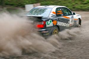 Matthew Johnson / Jeremy Wimpey	Subaru WRX kicks up dust on a hairpin on SS6.