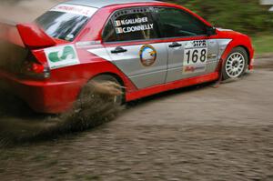 Celsus Donnelly / Noel Gallagher Mitsubishi Lancer Evo 8 almost put the car off the road at a hairpin on SS6.