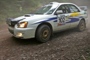 George Georgakopoulos / Faruq Mays Subaru WRX at a hairpin on SS6.
