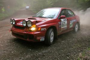 Bryan Pepp / Jerry Stang Subaru WRX at a hairpin on SS6.
