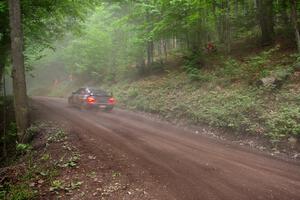 Josh Chang / Donald DeRose Subaru WRX STi blast uphill through the dust on SS6.