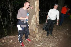 Rob Pantzer and Colin Bombara stand next to the tree that their Dodge Neon hit at speed.