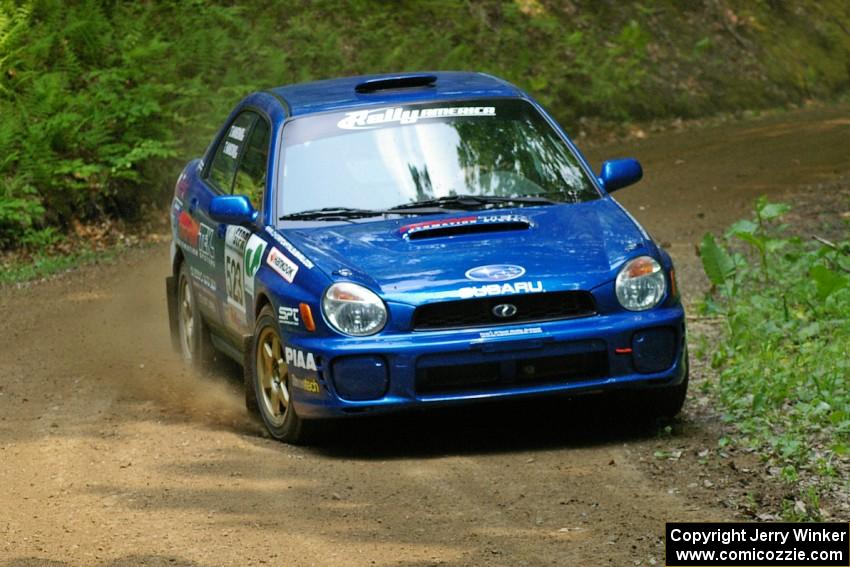 Travis Hanson / Terry Hanson at a hairpin on SS3 in their Subaru WRX.