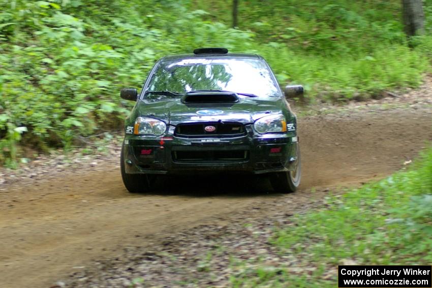 Josh Chang / Donald DeRose Subaru WRX STi gets a bit sideways out of a hairpin on SS3.