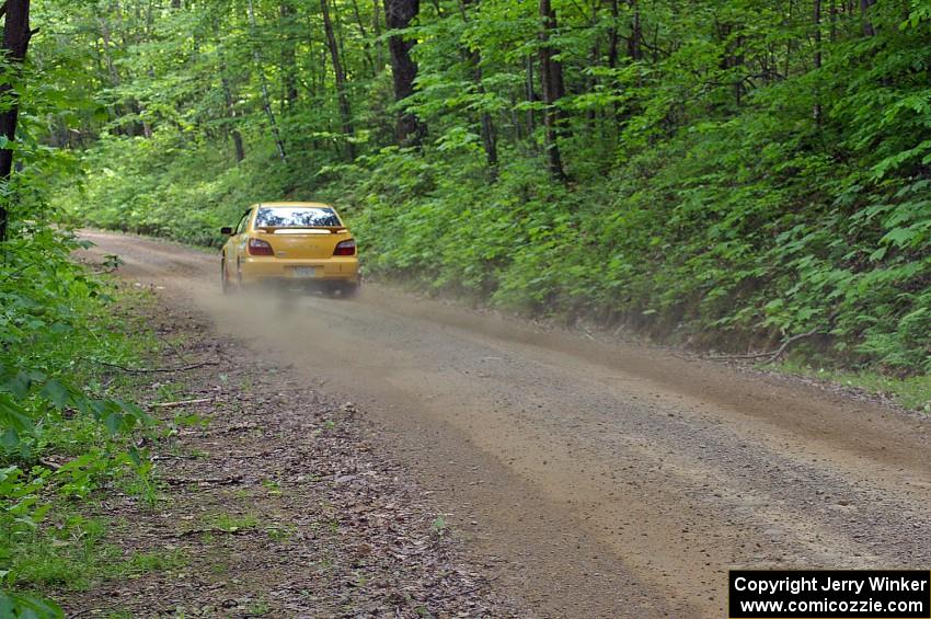 Scott Wilburn / Carrie Wilburn Subaru WRX rockets uphill on SS6.