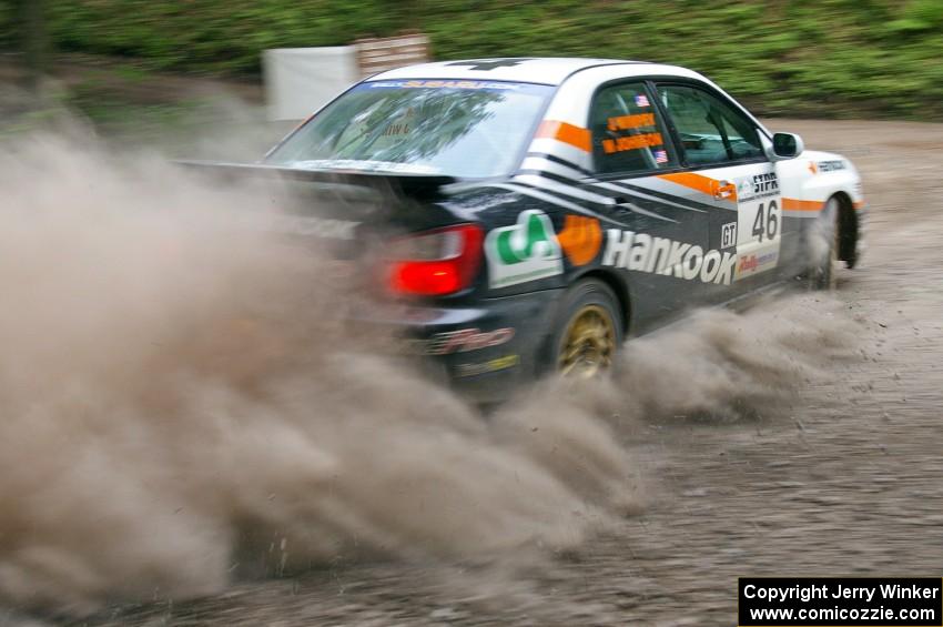 Matthew Johnson / Jeremy Wimpey	Subaru WRX kicks up dust on a hairpin on SS6.