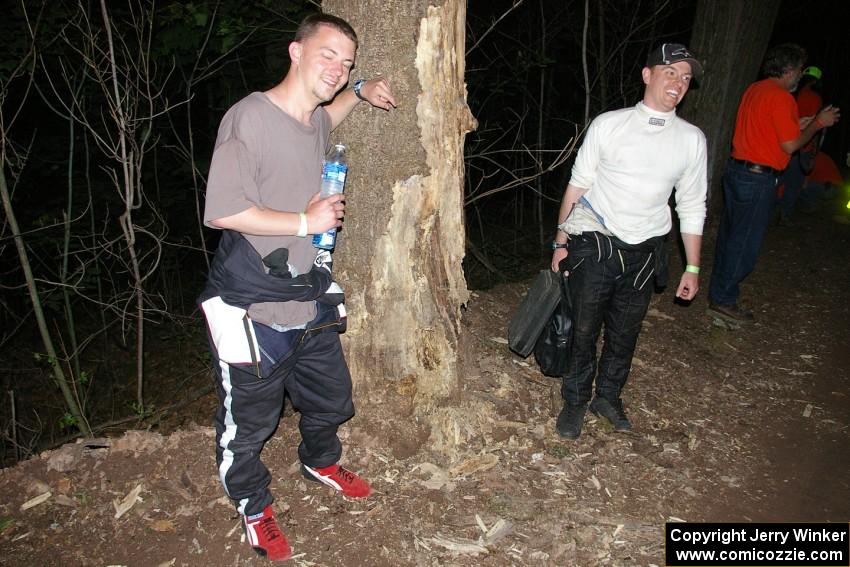 Rob Pantzer and Colin Bombara stand next to the tree that their Dodge Neon hit at speed.