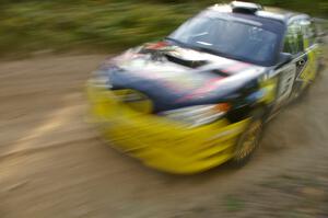 The Andy Pinker / Robbie Durant Subaru WRX STi takes a fast left-hander perfectly on the practice stage.