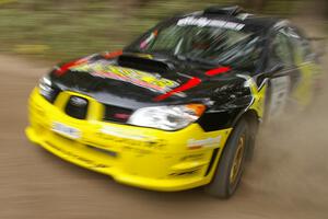 The Andy Pinker / Robbie Durant Subaru Impreza WRX STi on the press stage.