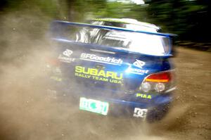 The Travis Pastrana / Christian Edstrom Subaru WRX STi sprays gravel on the press stage.