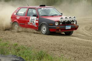 Karl Biewald / Scott Parrott VW GTI slings gravel on SS1 at the Bemidji Speedway.