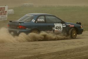 Martin Mennig / Ryan Schnell Subaru Impreza was barely visible through all the dust on SS1.