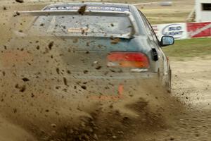 Jaroslaw Sozanski / Ben Slocum Subaru Impreza slings mud on SS1.