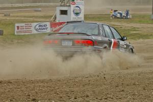 Evan Cline / Tracy Manspeaker in their Mitsubishi Galant GSX on SS1.