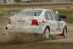 Lars Wolfe / Jeff Secor VW Jetta Turbo slings mud on the Super Special SS1 at Bemidji Speedway.