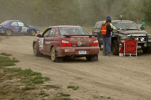 Bryan Pepp / Jerry Stang Subaru WRX checks into the finish control of SS1.