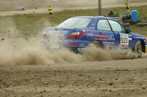 Travis Hanson / Terry Hanson Subaru WRX enters the infield on SS1 at the Bemidji Speedway.