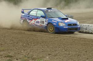 Kenny Bartram / Dennis Hotson Subaru WRX STi slings gravel on SS1 at the Bemidji Speedway.