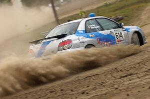 Piotr Wiktorczyk / Martin Brady	fly past on SS1 in their Subaru WRX.