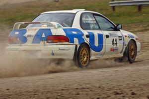 Henry Krolikowski / Cindy Krolikowski Subaru Impreza at a 90-left on SS1.